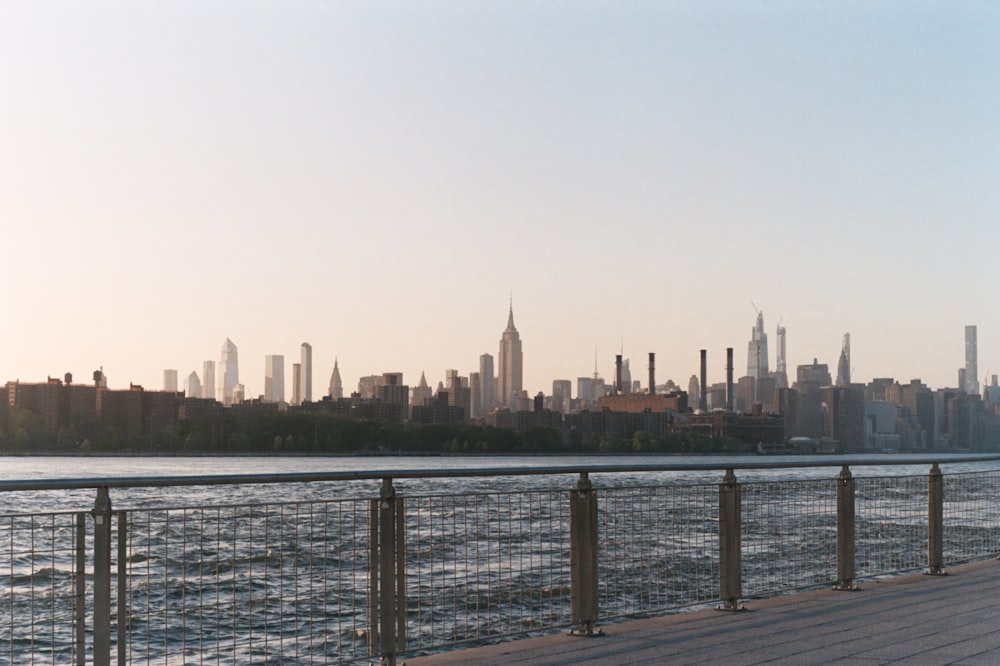 city skyline across body of water during daytime