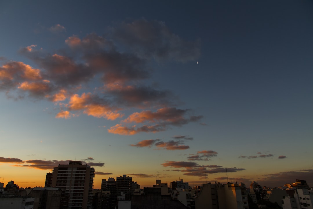 city buildings under blue sky during sunset