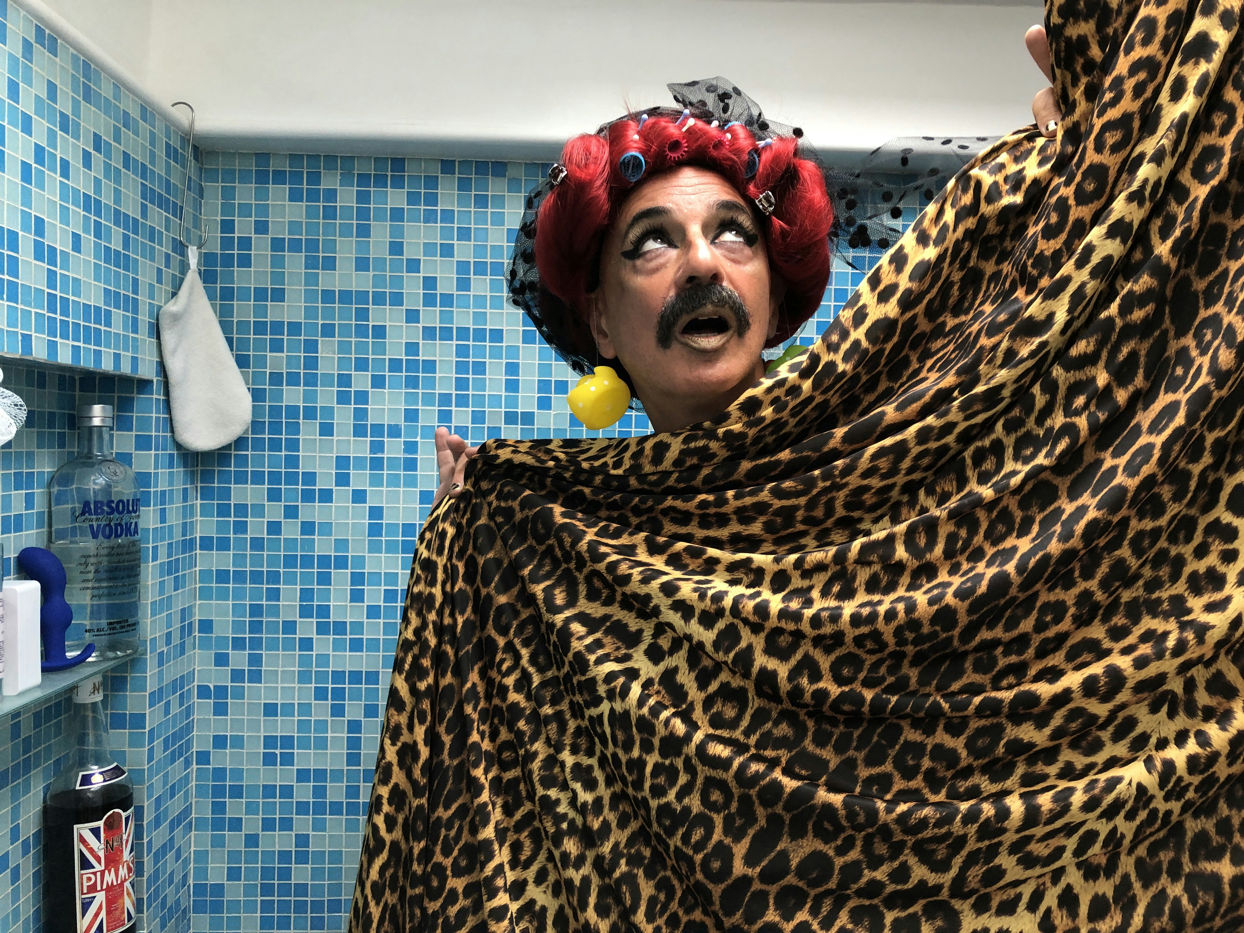 woman in brown and black leopard print hijab glamorous teams background