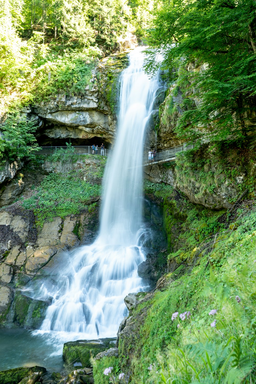 waterfalls on rocky mountain during daytime