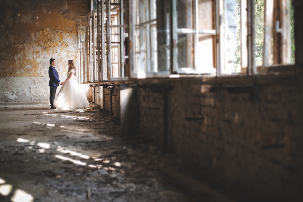 woman in white dress walking on hallway