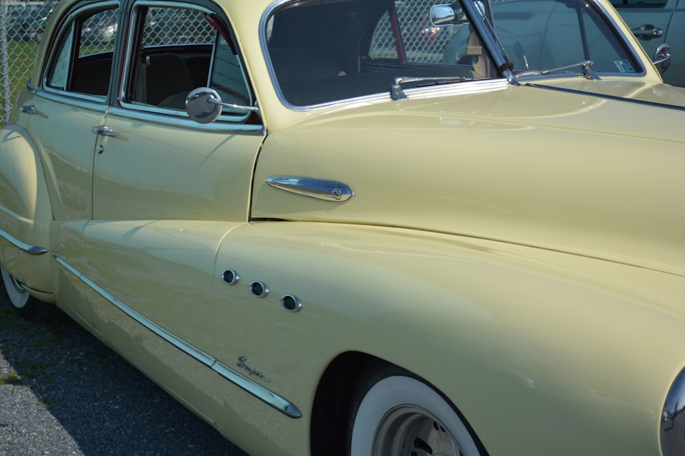 yellow classic car on gray asphalt road during daytime