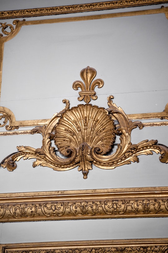 gold and white floral wall decor in Château de Versailles France