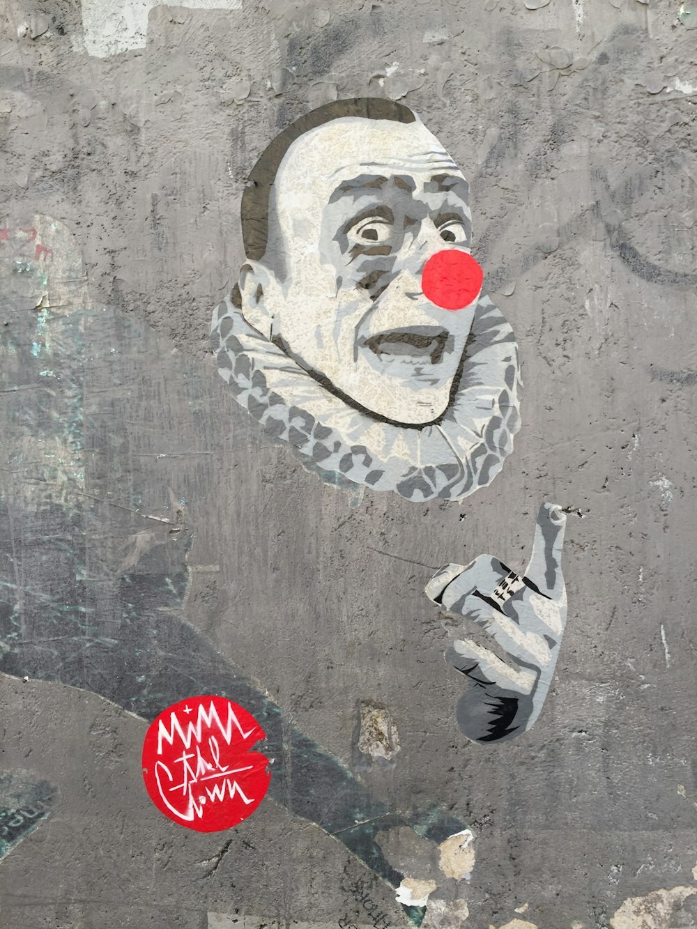 white red and black face painted on wall