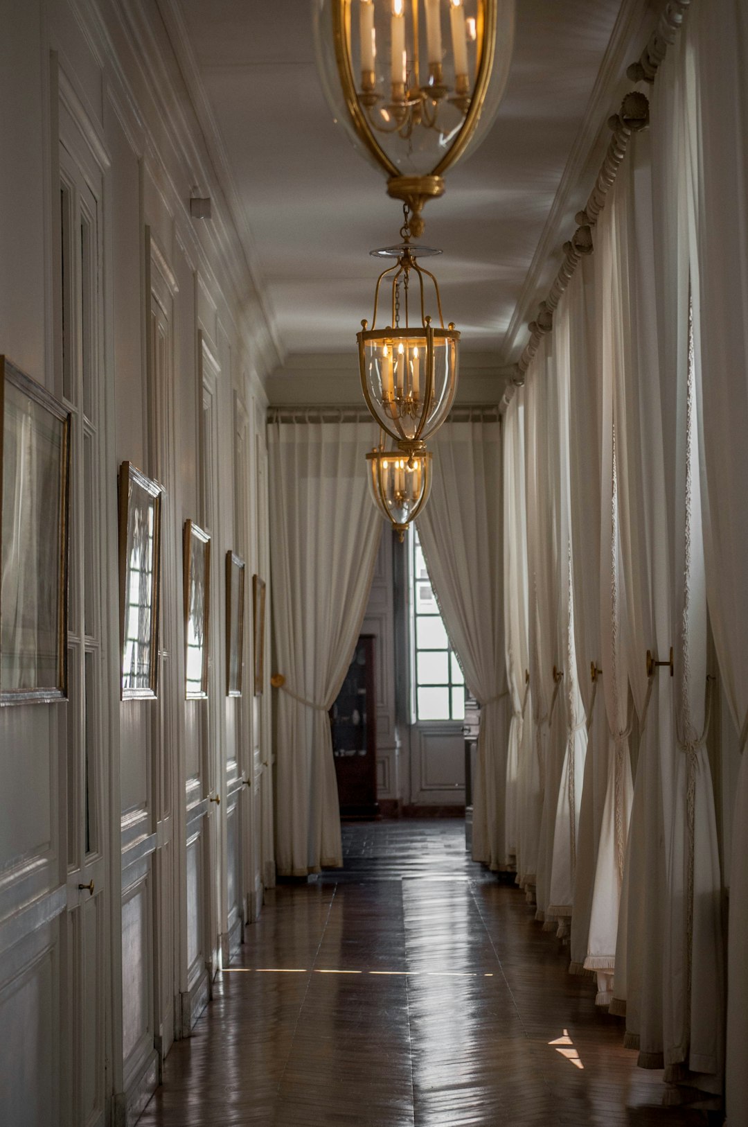 gold pendant lamp on hallway