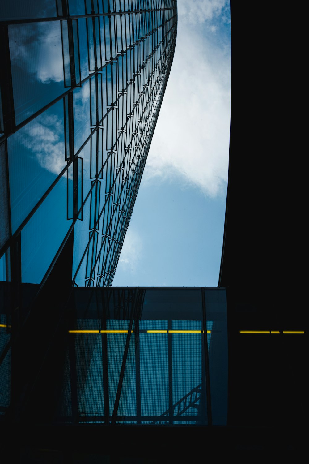 blue and black glass walled building