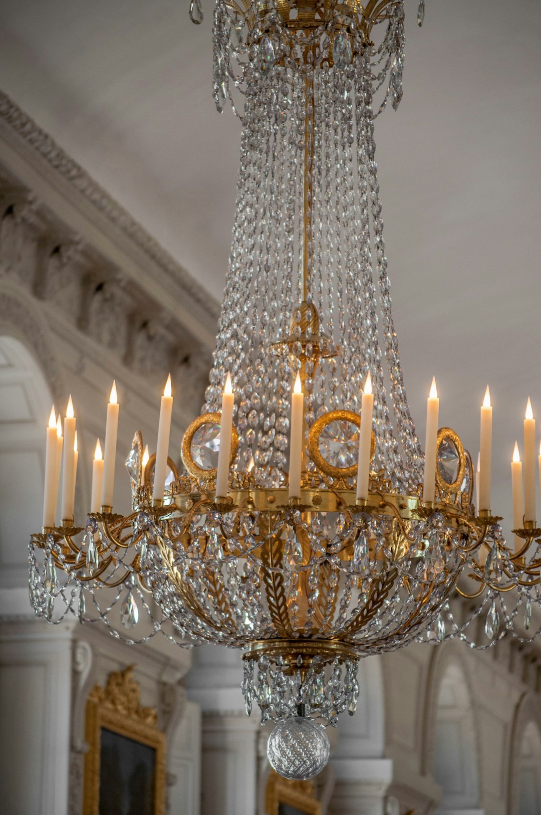 gold and white uplight chandelier