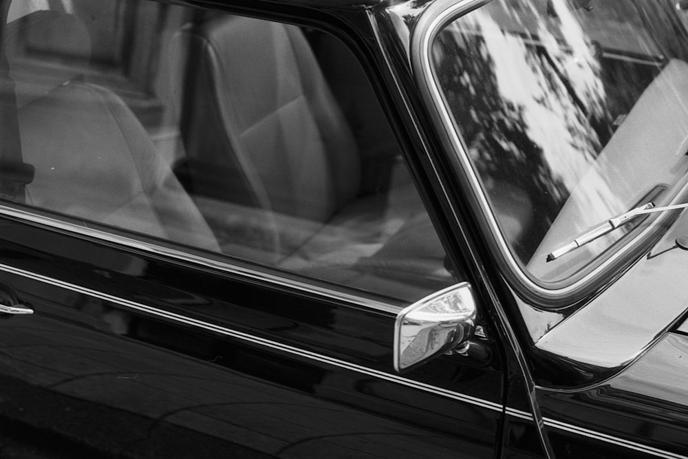 grayscale photo of car side mirror