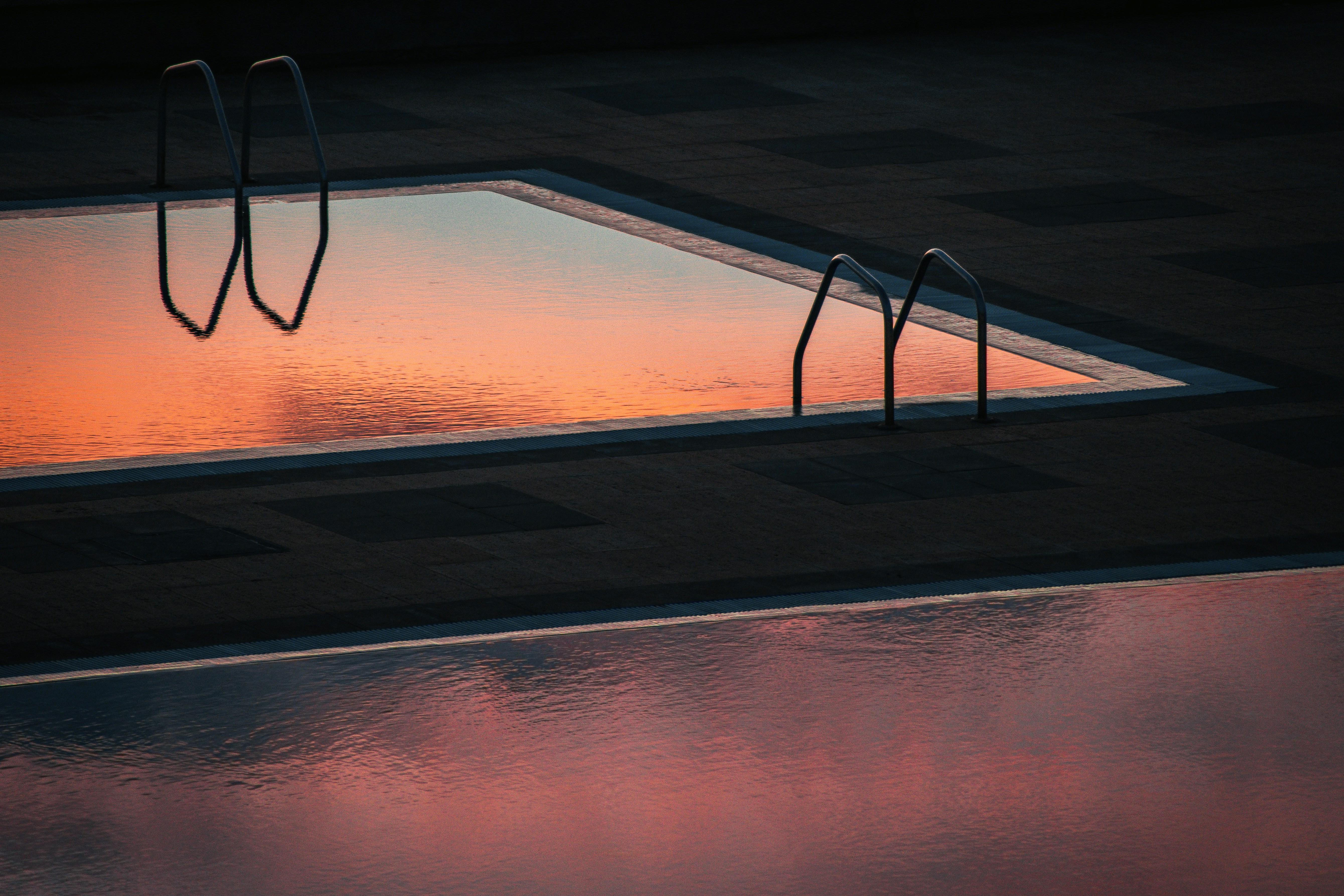 black framed eyeglasses on brown wooden table