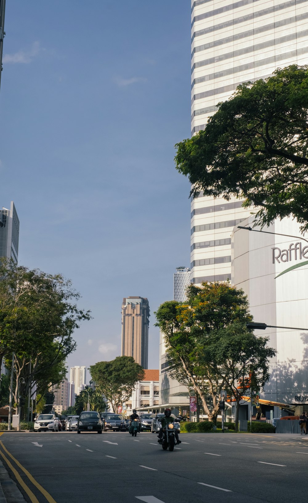 green trees near white concrete building during daytime