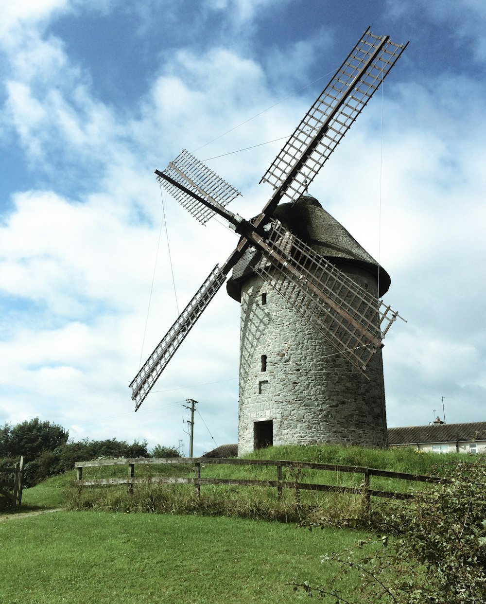 gray and black windmill under blue sky during daytime