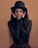 woman in black long sleeve shirt and black hat