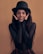 woman in black long sleeve shirt and black hat