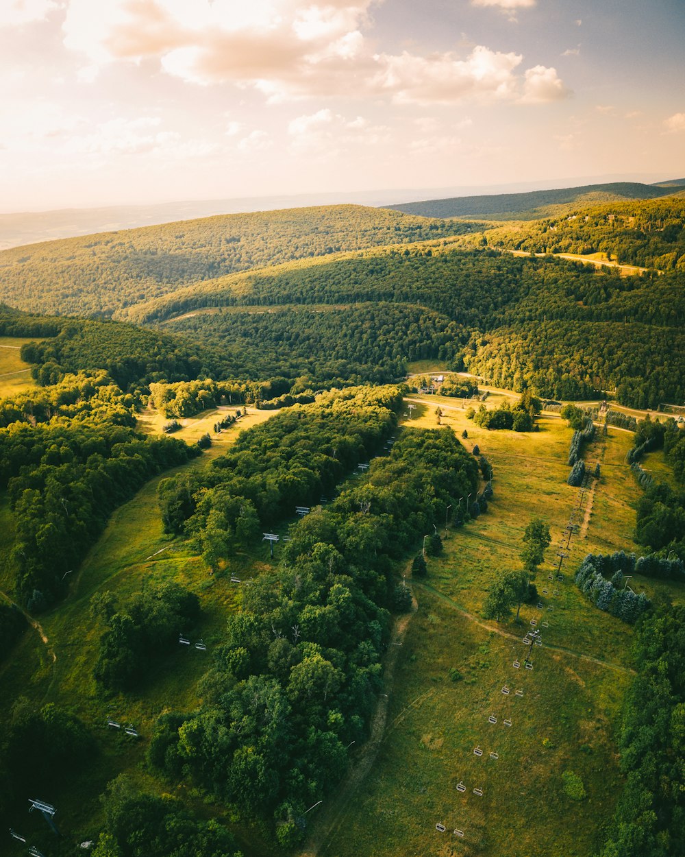 an aerial view of a lush green valley