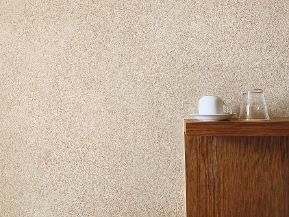 white plastic bottle on brown wooden table