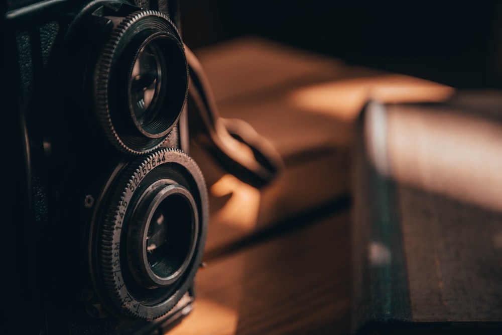 black camera on brown wooden table