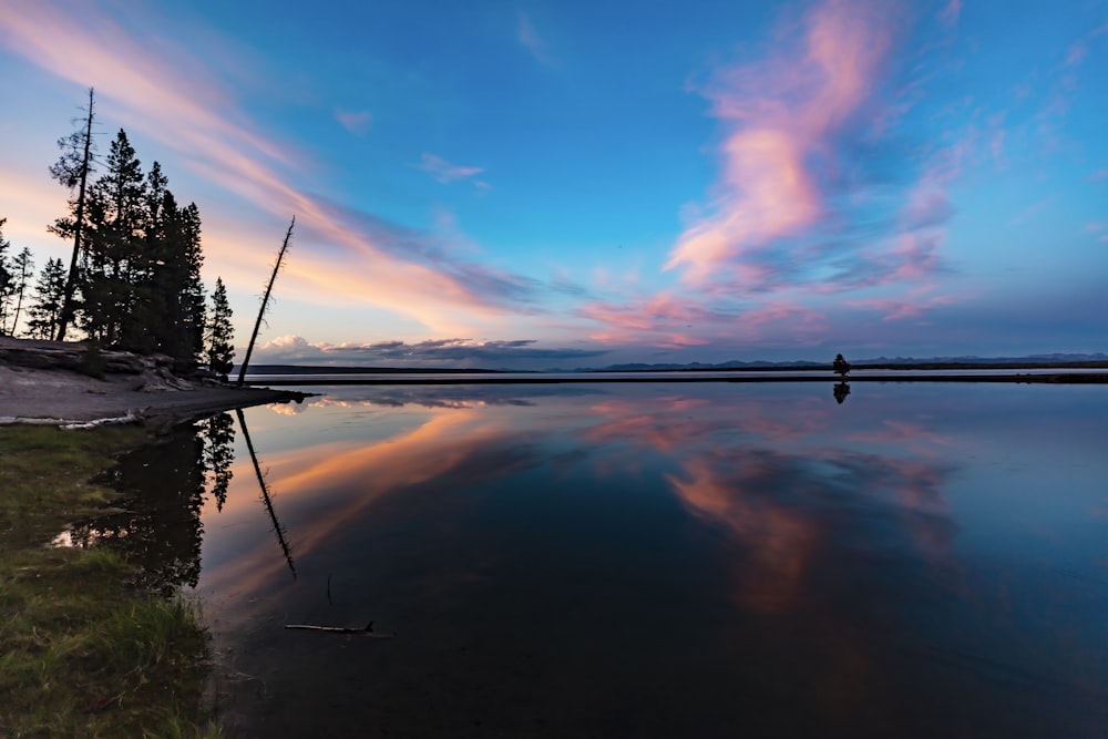 body of water under blue sky