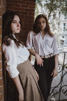 woman in white dress shirt and black skirt