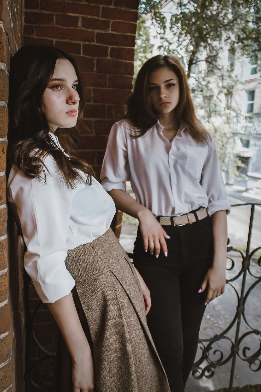 woman in white dress shirt and black skirt