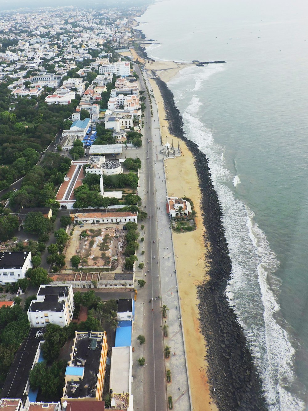 an aerial view of a beach and a city