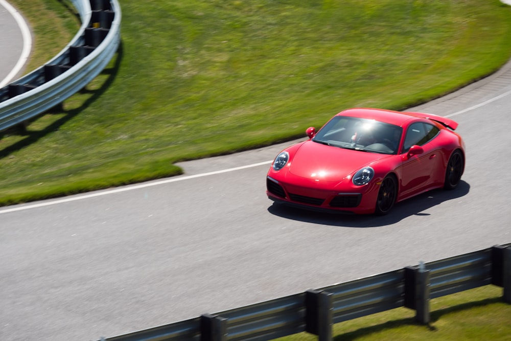 red ferrari 458 italia on road during daytime