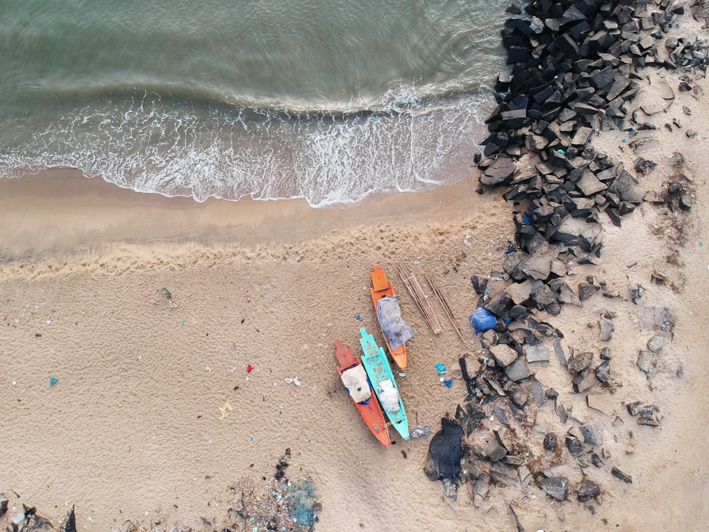 aerial view of boats on sea shore during daytime