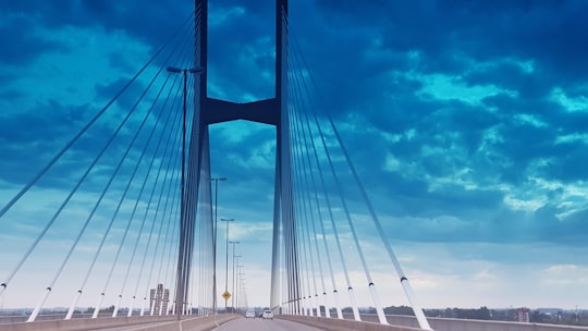 white and gray bridge under gray clouds in Rosario Argentina