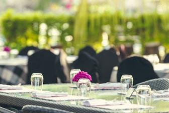 Elegant chairs and tables arranged for a sophisticated outdoor wedding