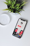 iphone xs on white table