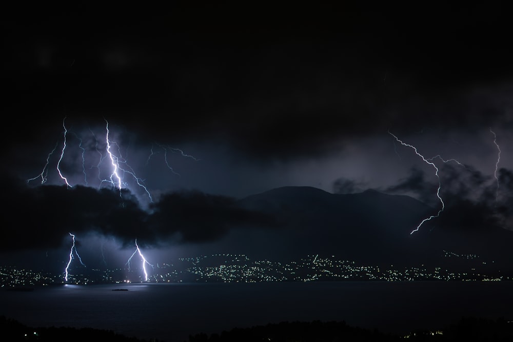 lightning strike on mountain during night time