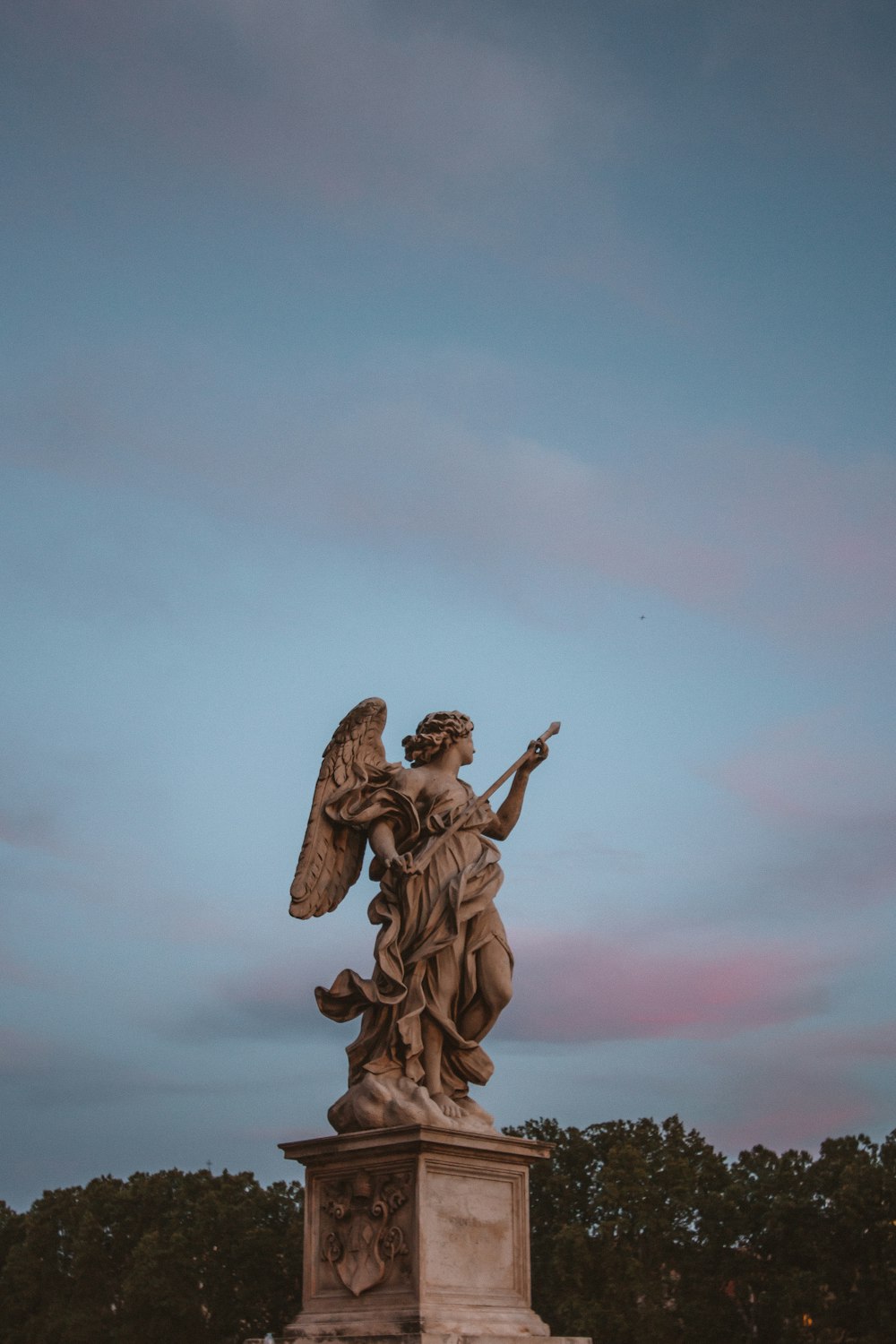 angel statue under blue sky during daytime