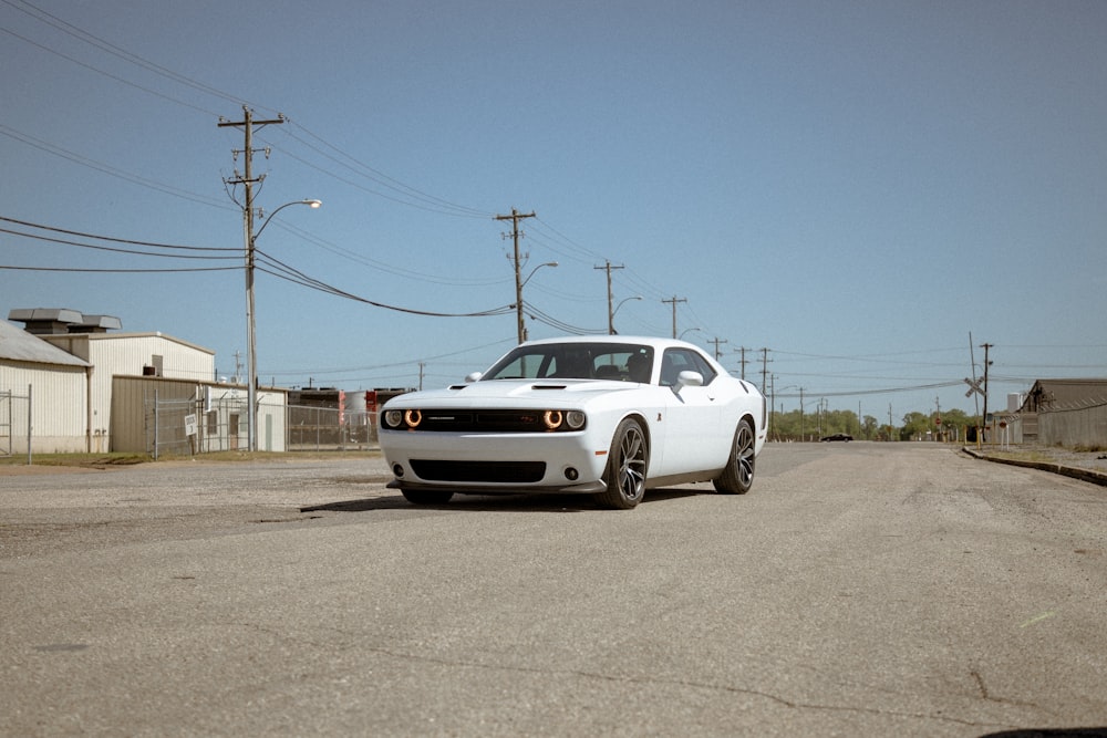 white chevrolet camaro on road during daytime