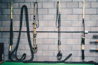 black and white rope on brown brick wall