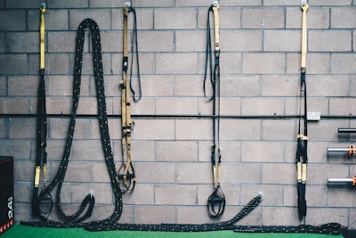 black and white rope on brown brick wall