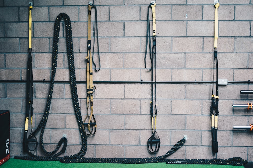 black and white rope on brown brick wall