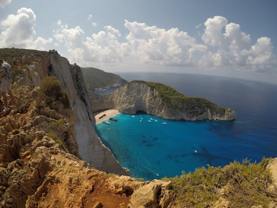 aerial view of blue sea under white clouds and blue sky during daytime in Shipwreck View Point Greece
