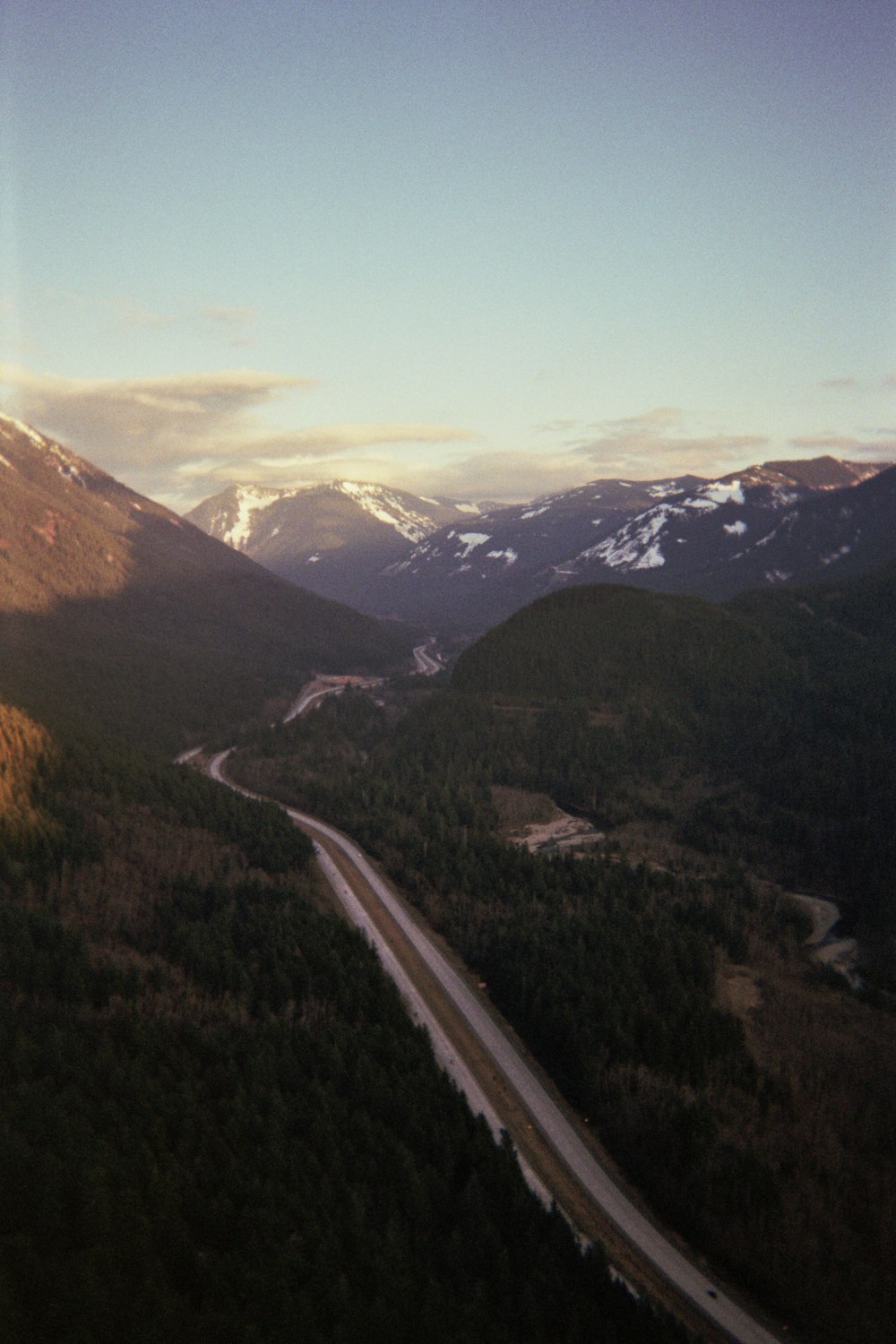 aerial view of road between mountains during daytime