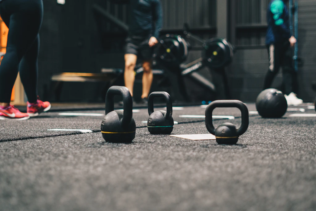 Weight plate storage rack in a functional gym setup