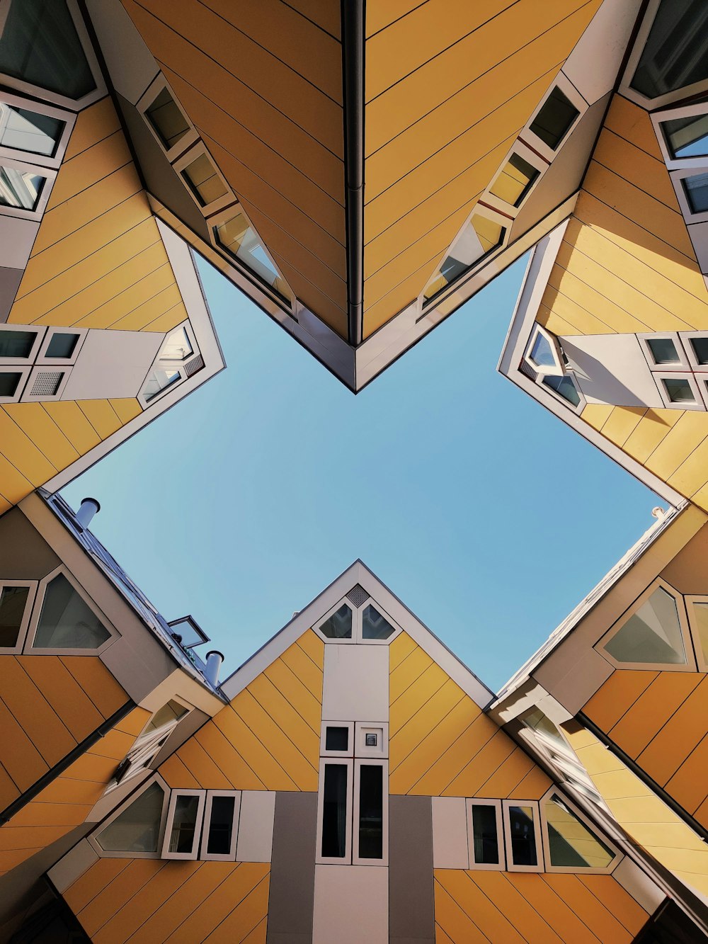 brown and white concrete building under blue sky during daytime