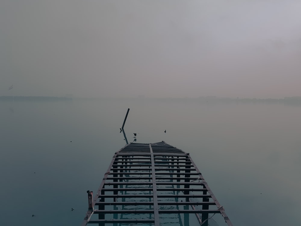 black and white building near body of water