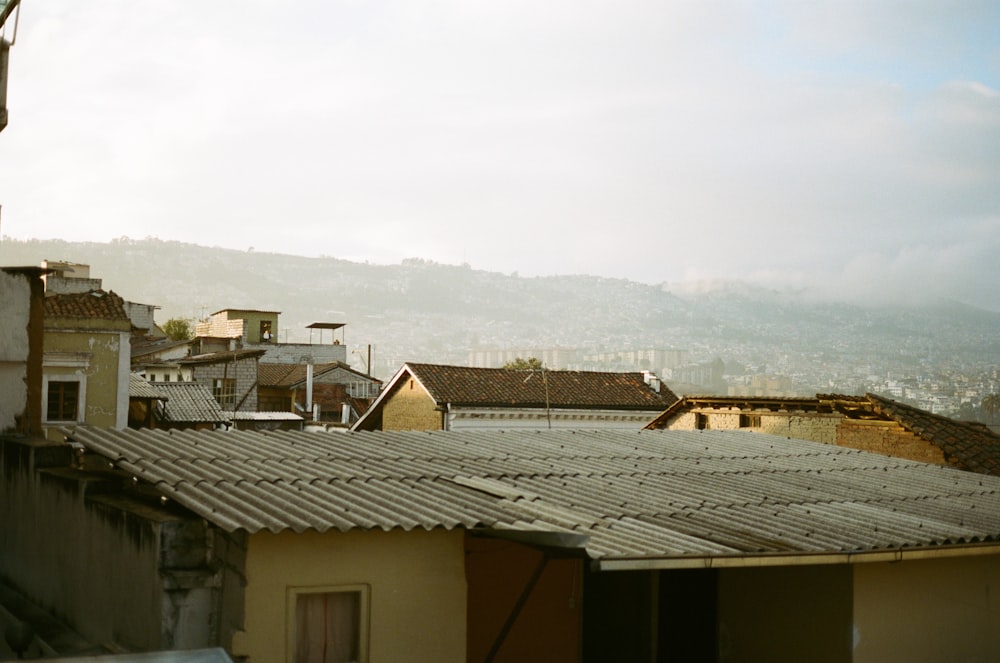 white and brown concrete house under white sky during daytime