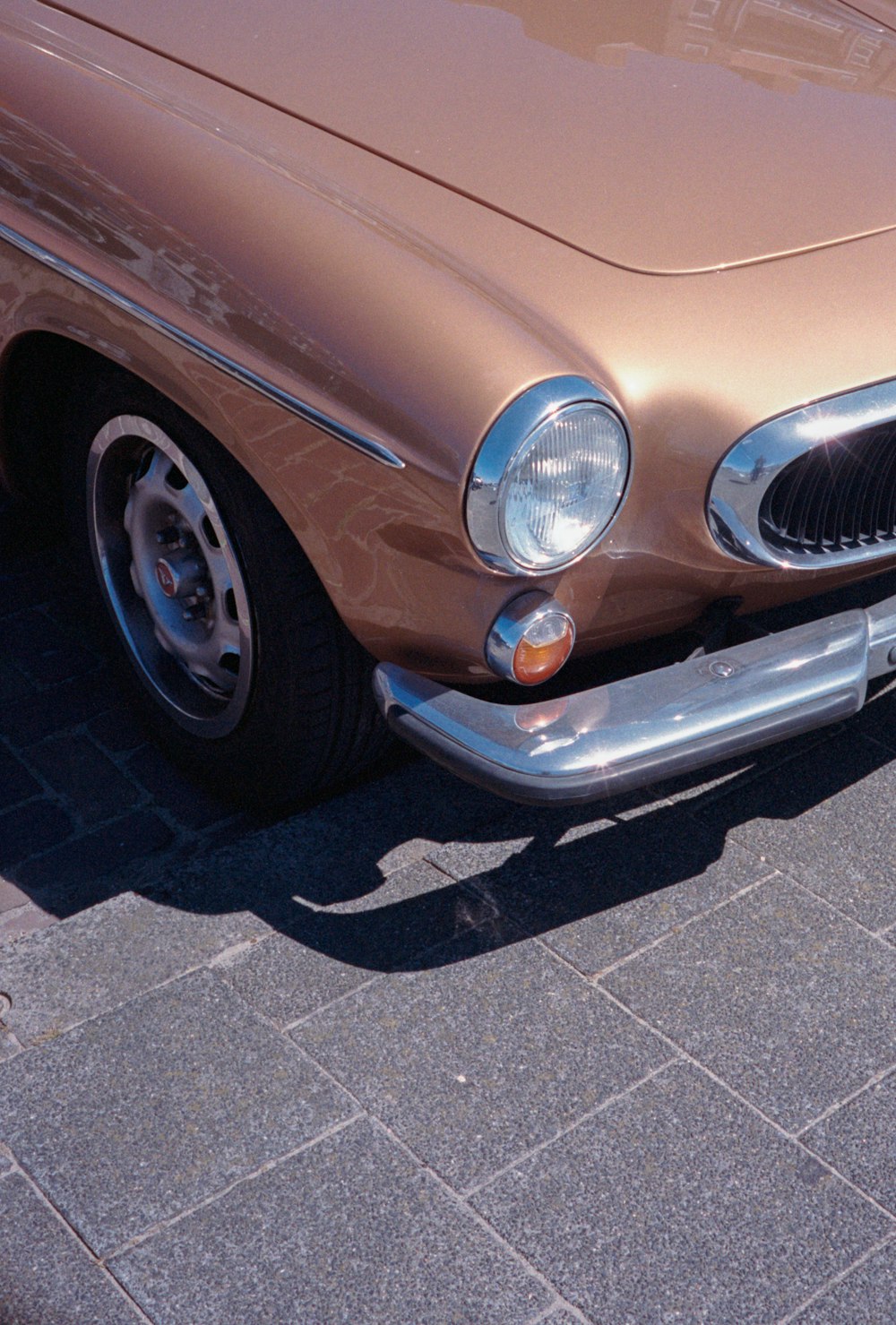 blue car with chrome wheel