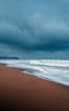 ocean waves crashing on shore during daytime