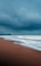 ocean waves crashing on shore during daytime