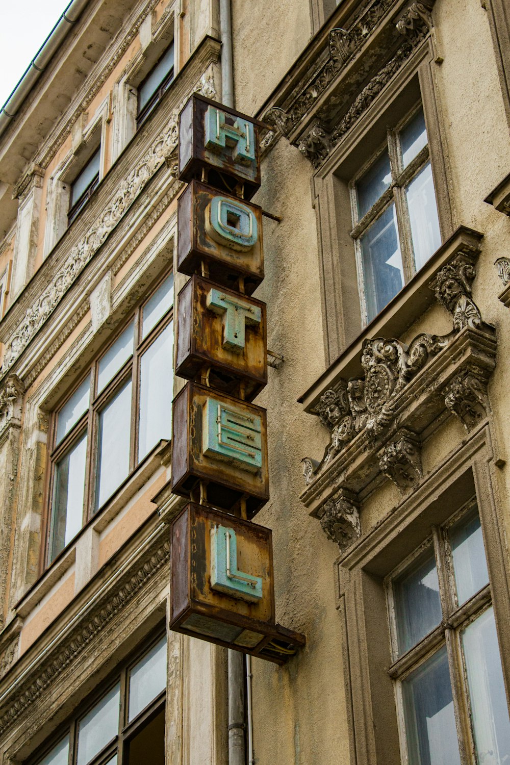 brown concrete building with glass windows