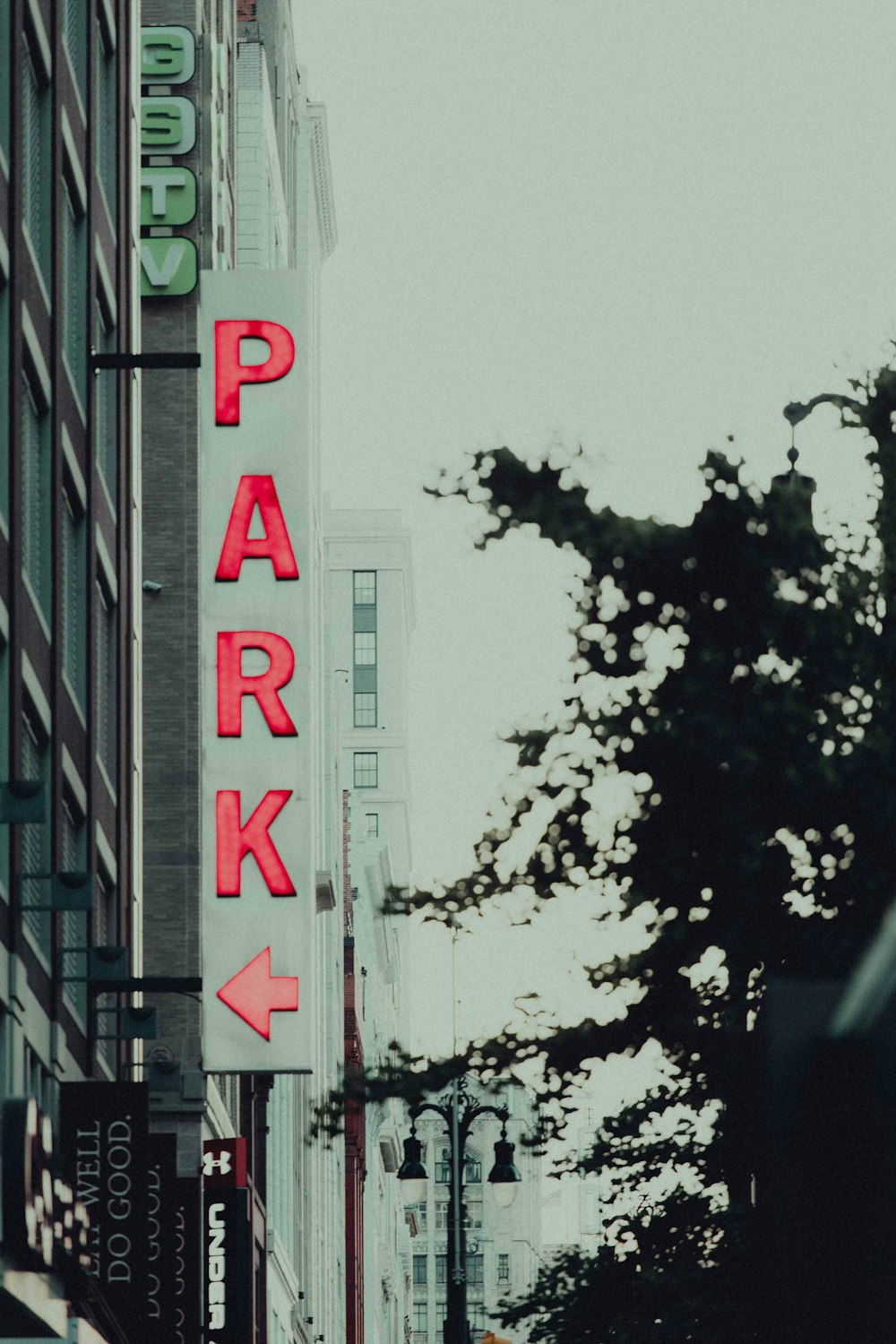 a sign that says park on the side of a building