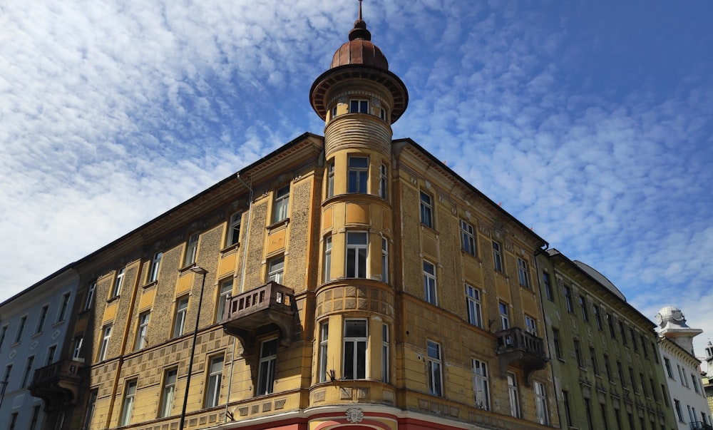 brown concrete building under blue sky during daytime