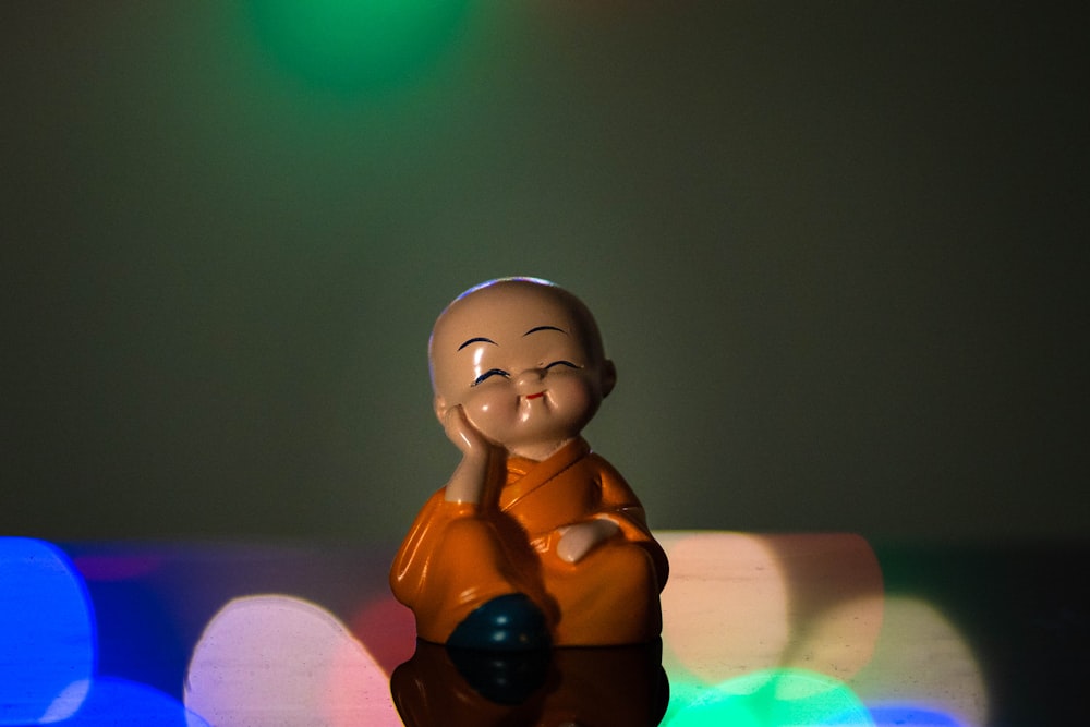 brown wooden figurine on white table