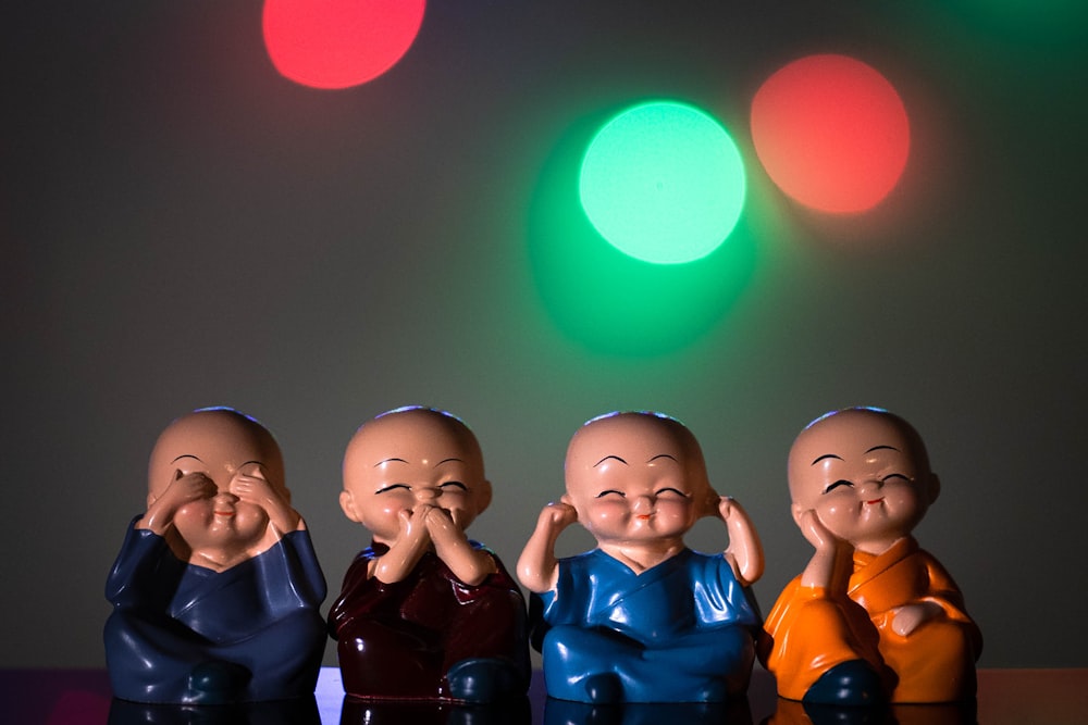 3 boys in blue and black shirts