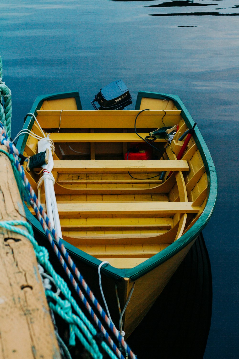 yellow and blue boat on water